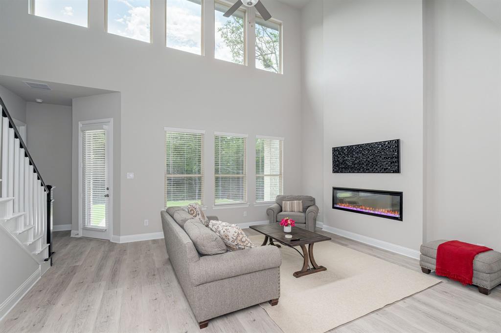 1412 Bear Path Way Gunter, TX 75058 - Photo 10 of 37 a living room with furniture and a large window