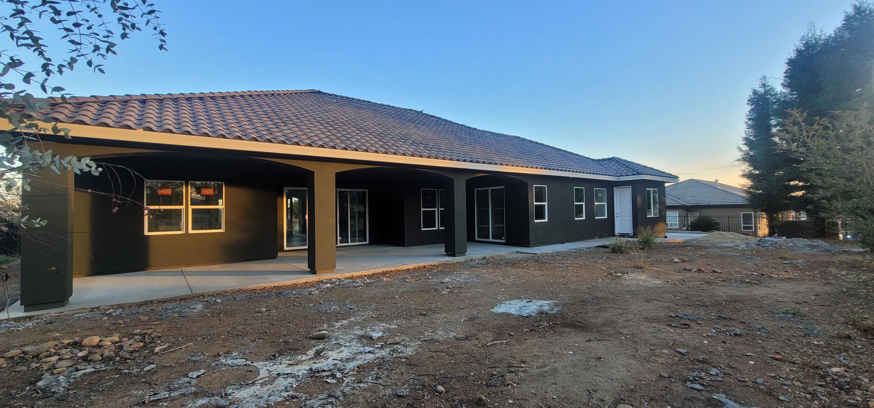 910 Santa Cruz Drive Redding, CA 96003 - Photo 11 of 28 a front view of a house with a yard
