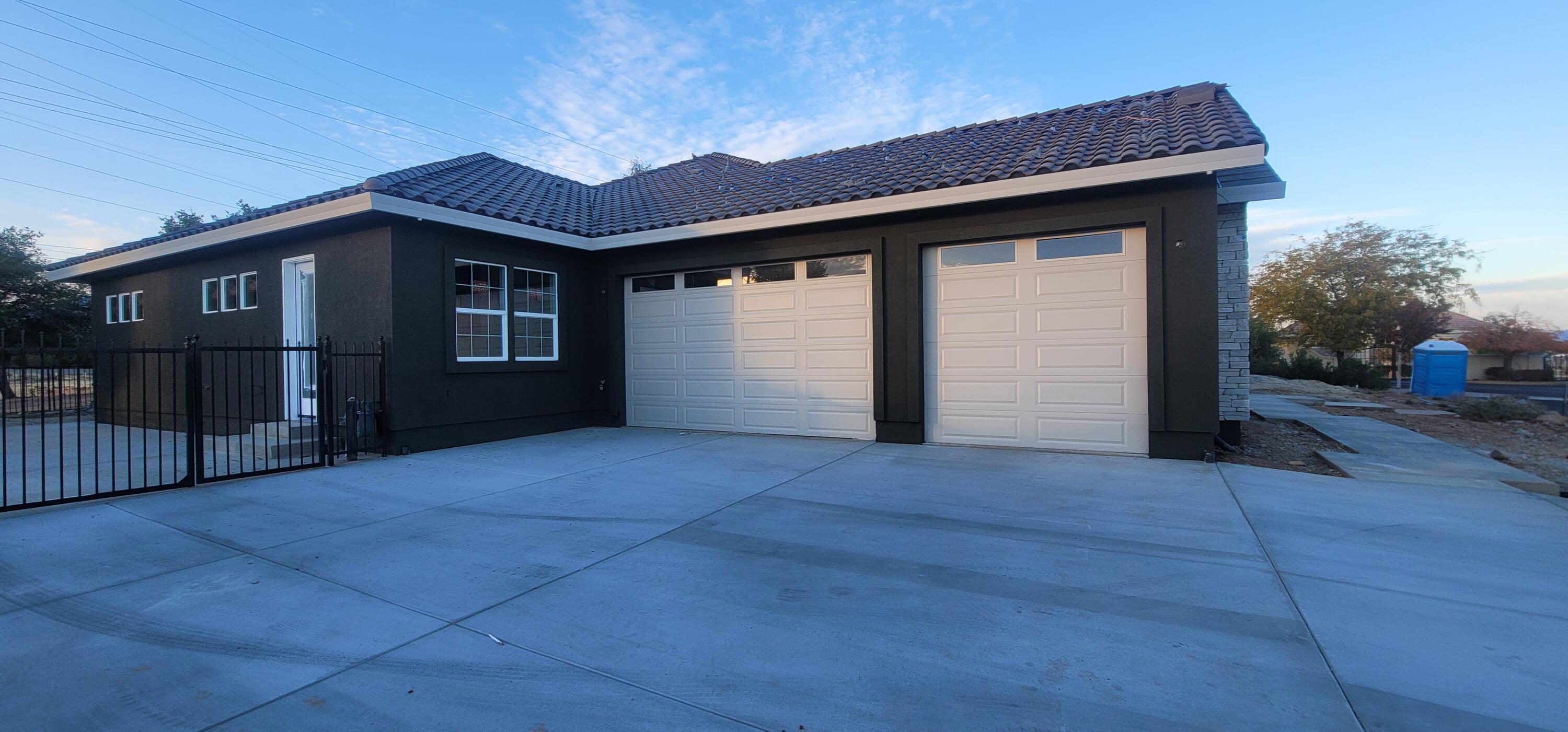 910 Santa Cruz Drive Redding, CA 96003 - Photo 12 of 28 a front view of a house with a yard and garage