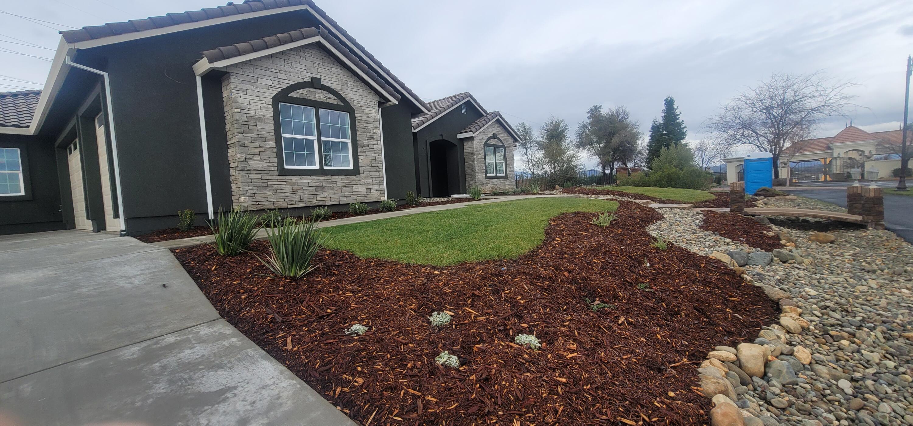 910 Santa Cruz Drive Redding, CA 96003 - Photo 24 of 28 a front view of a house with a yard