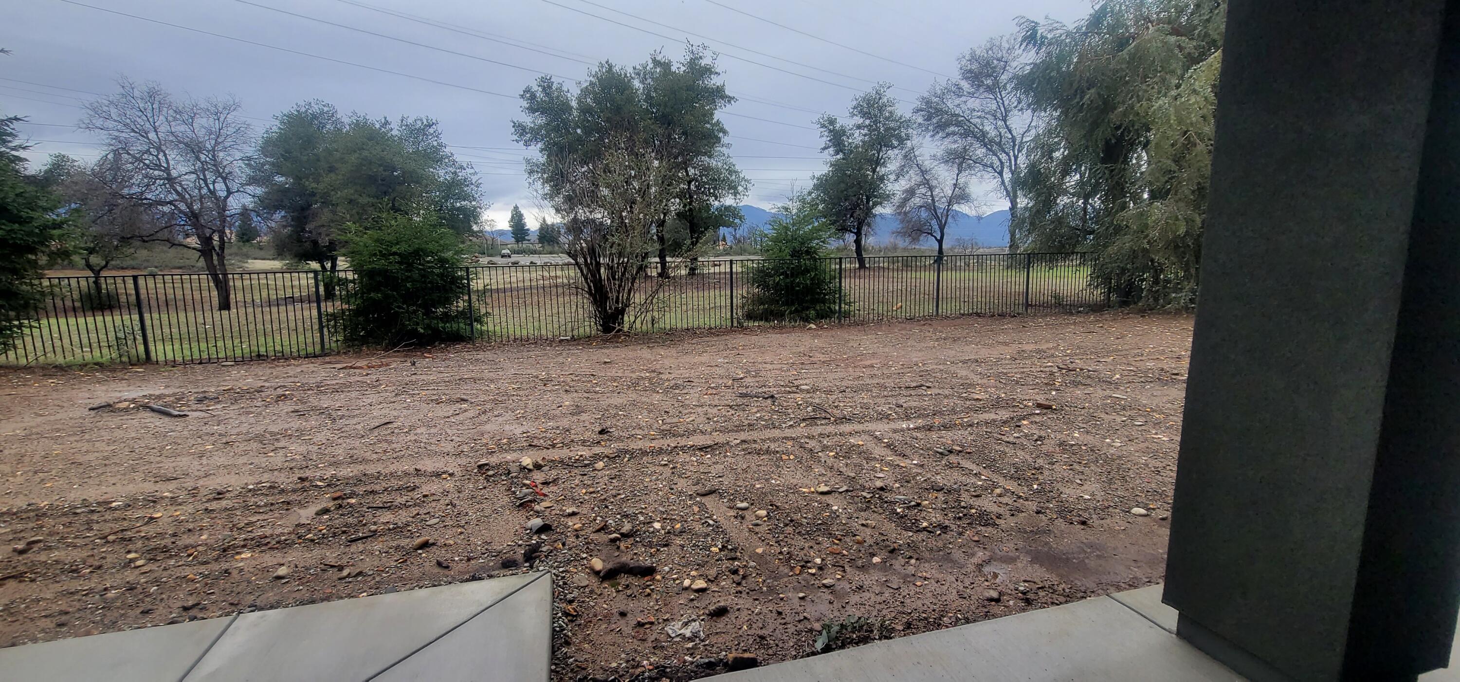 910 Santa Cruz Drive Redding, CA 96003 - Photo 26 of 28 a view of a backyard with large trees