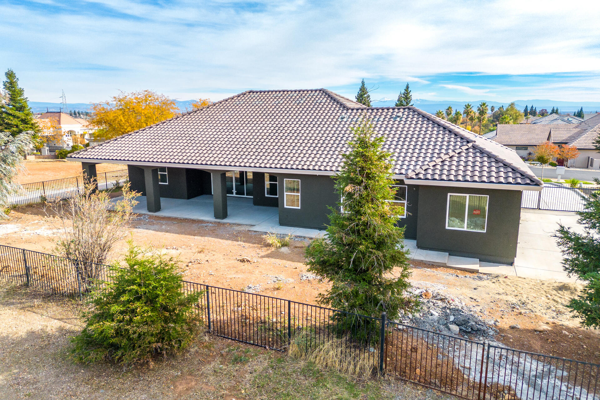 910 Santa Cruz Drive Redding, CA 96003 - Photo 6 of 28 a front view of a house with a garden