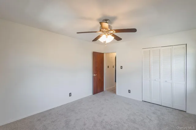 a view of a chandelier fan in a room