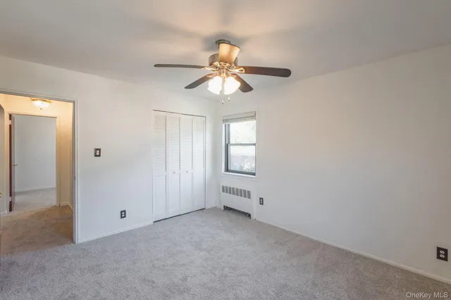 a view of a chandelier fan in a room