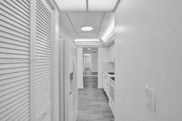 a view of a hallway with seating area