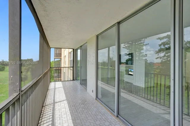 a bathroom with a glass door shower and mirror