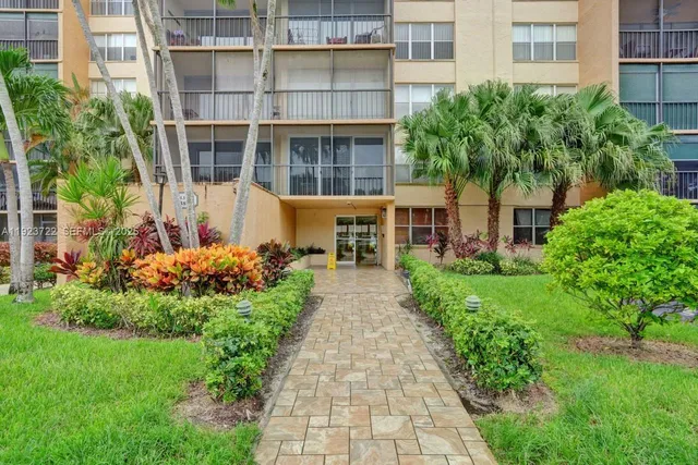 a view of a back yard of the house and a garden
