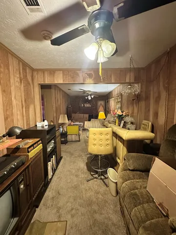 a bedroom with two beds and a chandelier