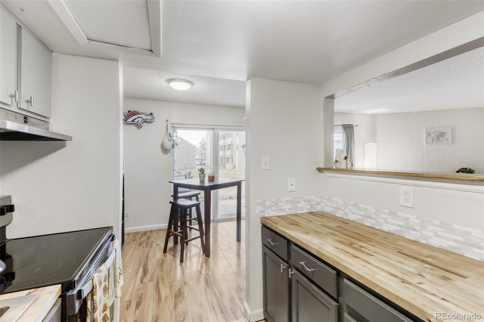 3428 South Locust Street, Unit B Denver, CO 80222 - Photo 9 of 9 a spacious bathroom with a granite countertop sink