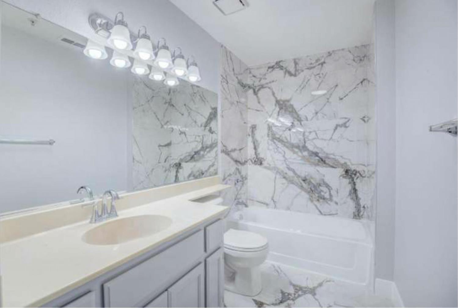 8020 Walerga Road, Unit 1147 Antelope, CA 95843 - Photo 11 of 20 a bathroom with a sink vanity mirror and toilet