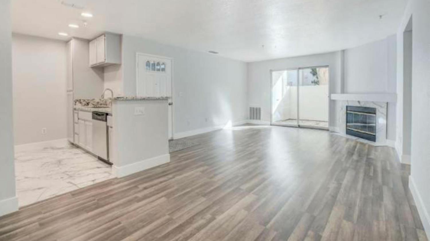 8020 Walerga Road, Unit 1147 Antelope, CA 95843 - Photo 6 of 20 a view of a kitchen with wooden floor and a window