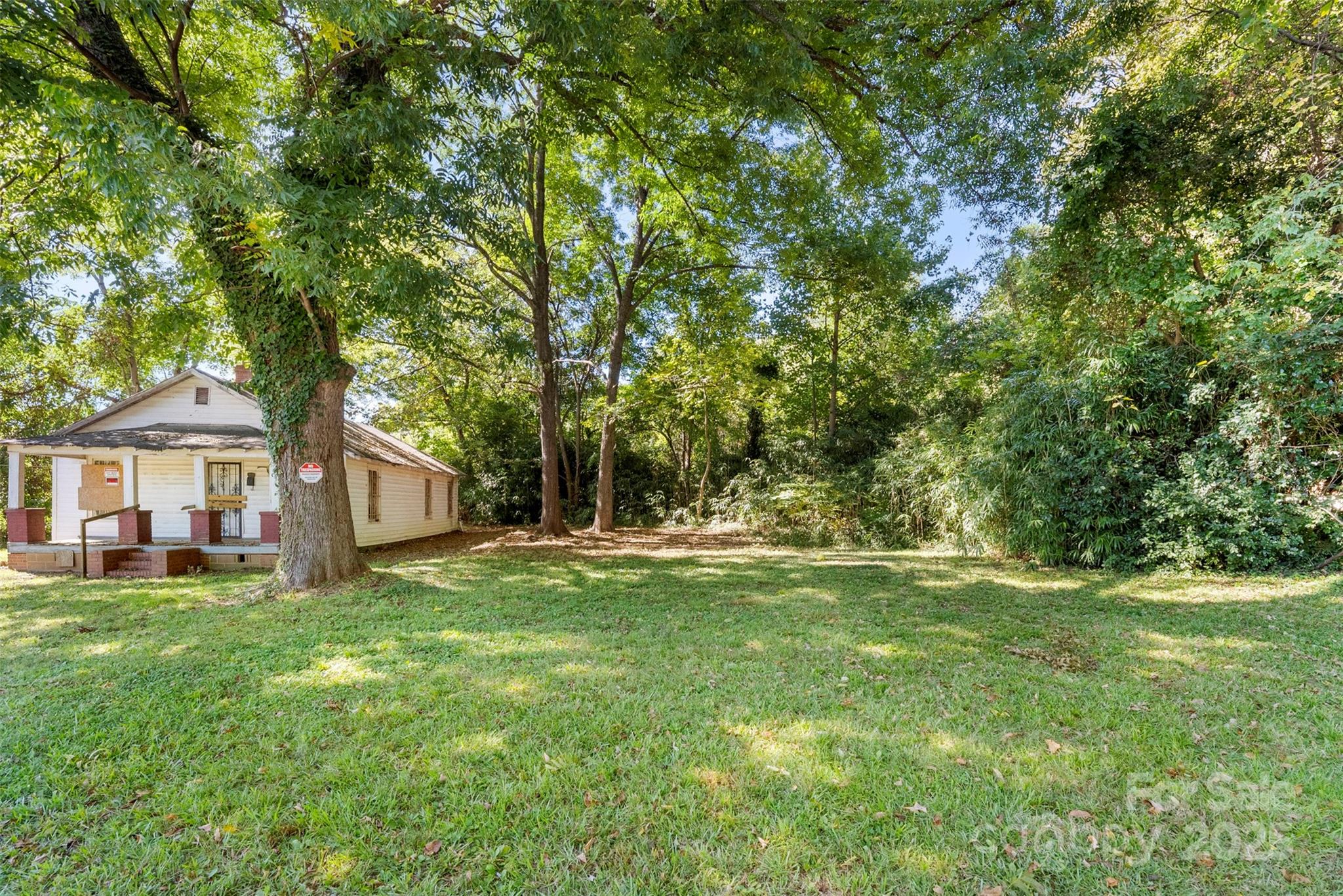 3444 Marvin Road Charlotte, NC 28211 - Photo 21 of 34 a view of a house with a big yard and large trees
