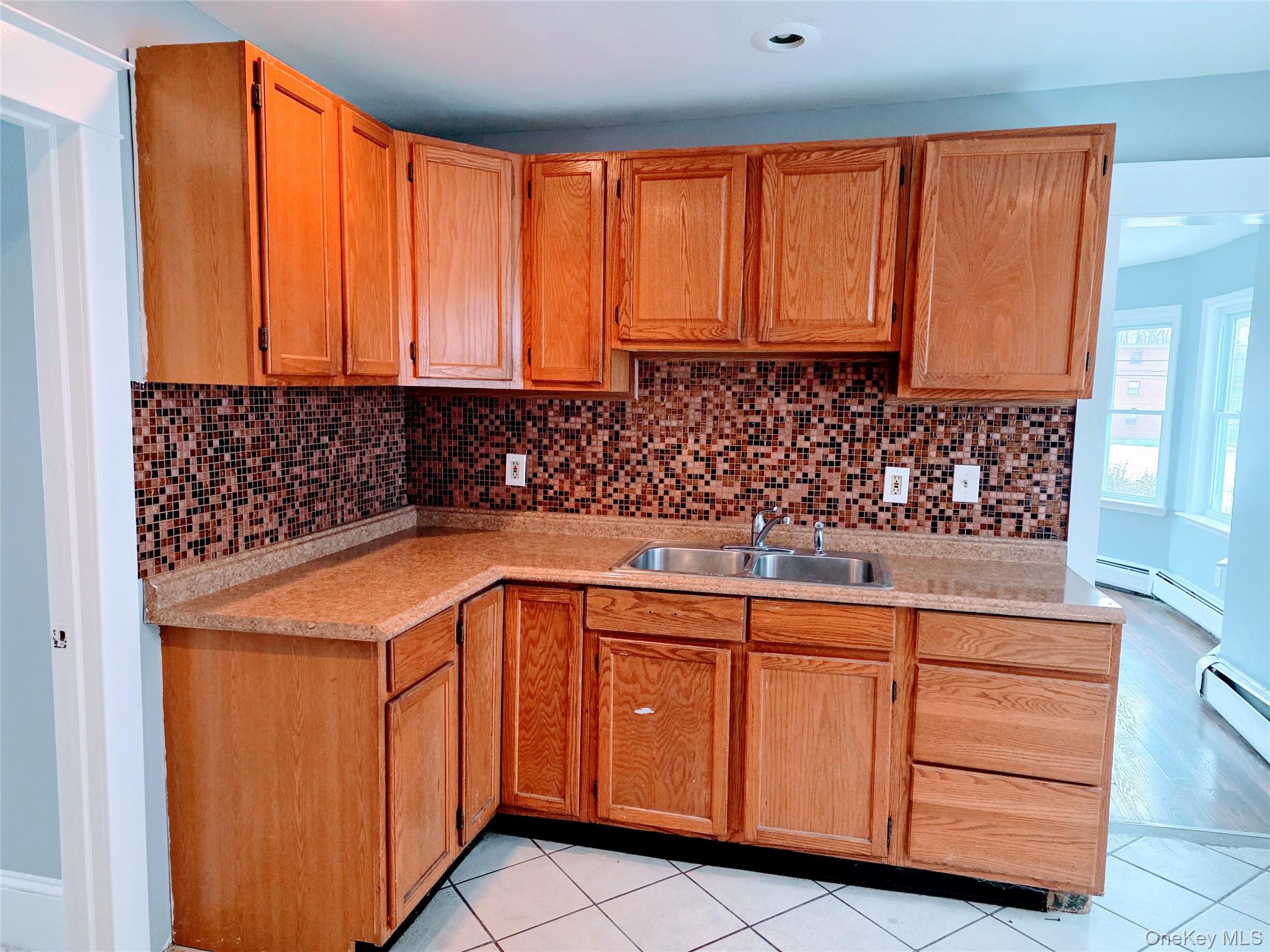 210 Smith Street Poughkeepsie, NY 12601 - Photo 12 of 44 a utility room with granite countertop cabinets and washer dryer