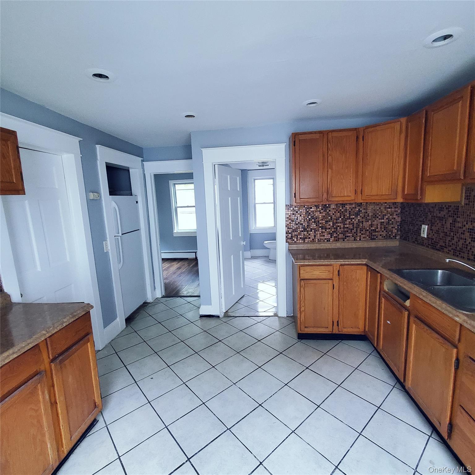 210 Smith Street Poughkeepsie, NY 12601 - Photo 15 of 44 a kitchen with stainless steel appliances granite countertop a refrigerator and a stove