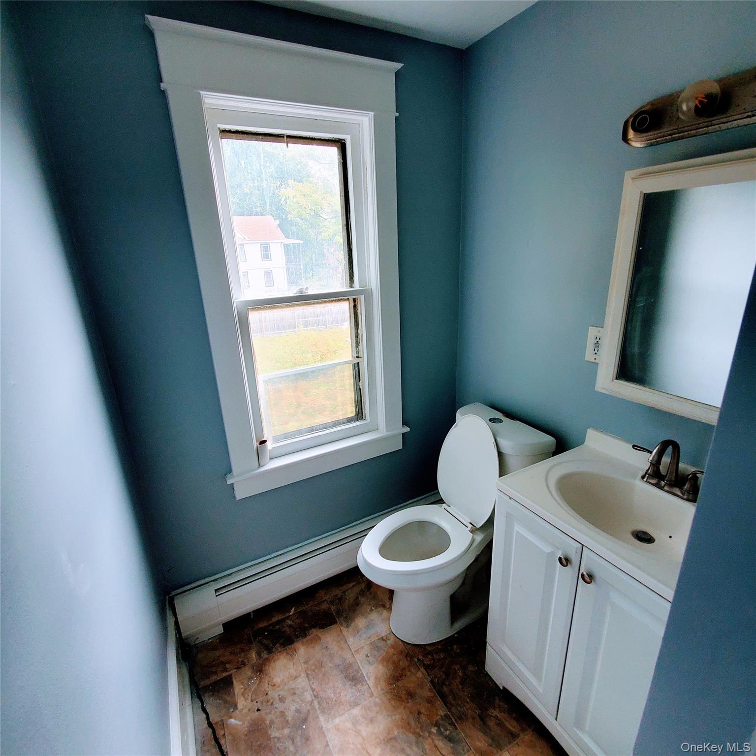 210 Smith Street Poughkeepsie, NY 12601 - Photo 31 of 44 a bathroom with a toilet sink and mirror