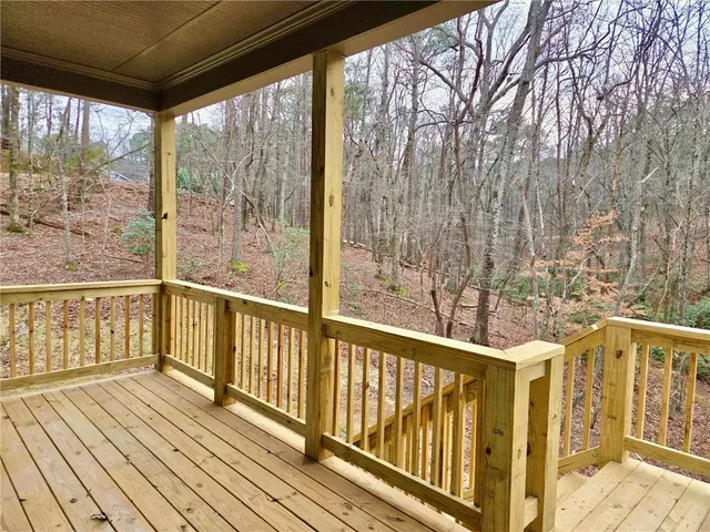 a view of a balcony with wooden floor