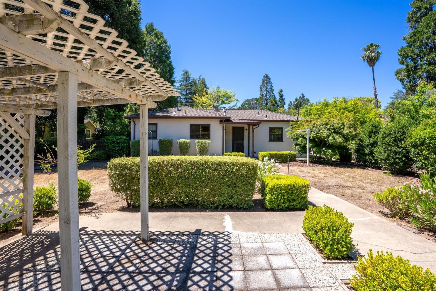 16899 Kennedy Road Los Gatos, CA 95032 - Photo 32 of 61 a front view of a house with a yard
