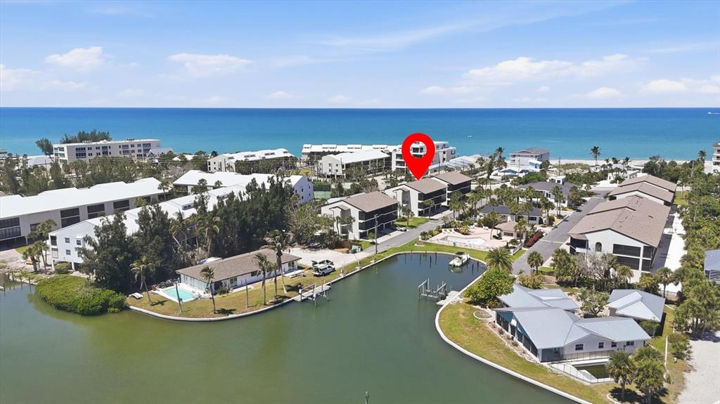 2729 North Beach Road, Unit 211 Englewood, FL 34223 - Photo 1 of 51 an aerial view of a house with a swimming pool outdoor seating yard and mountain view