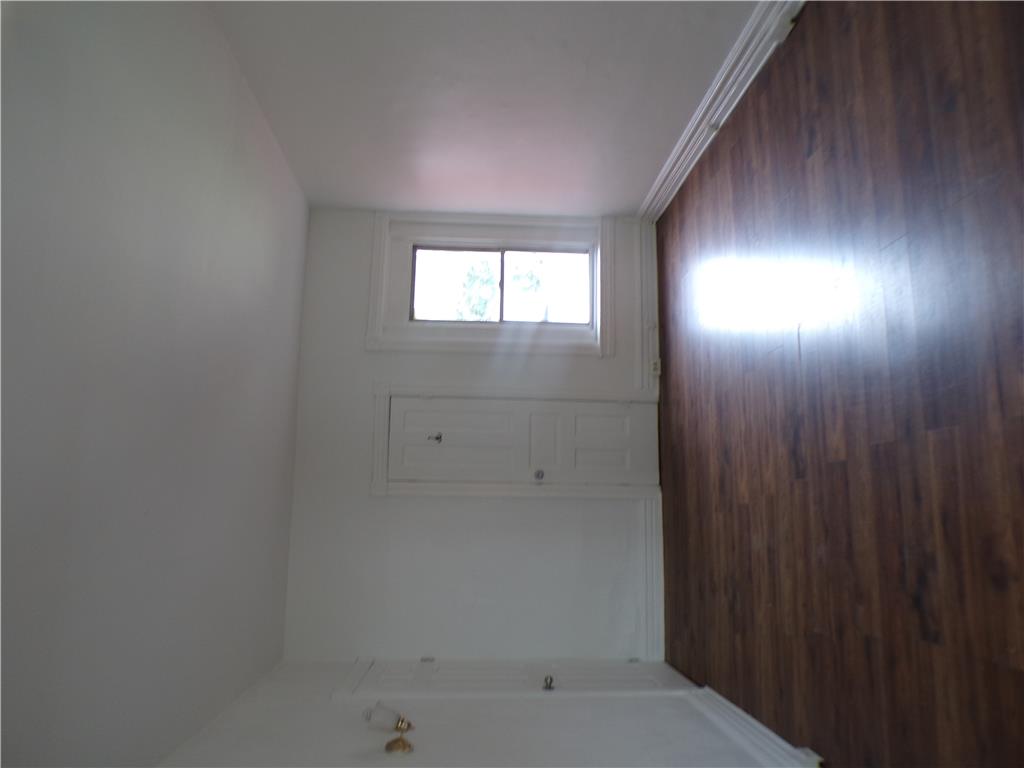 111 Ridge Avenue Allentown, PA 18102 - Photo 11 of 15 Second floor walk through bedroom #1 with rich hardwood-style flooring extends across this versatile interior space, illuminated by natural light.