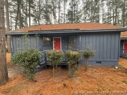 a backyard of a house with yard and outdoor seating