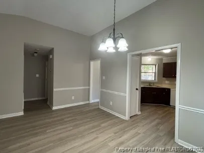 a large kitchen with stainless steel appliances granite countertop a stove a sink dishwasher and a microwave