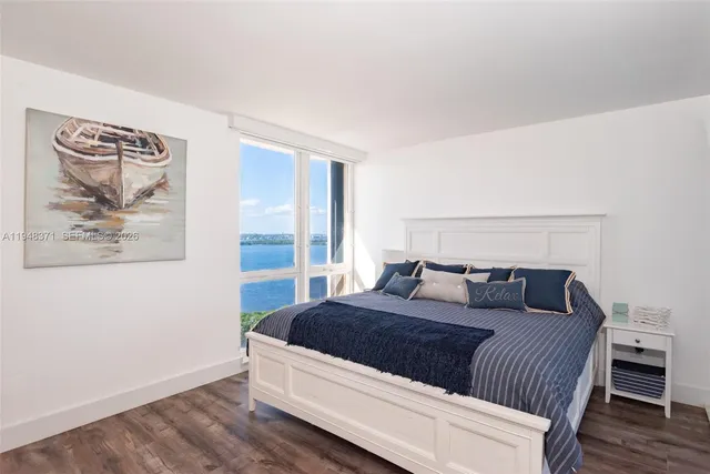 a living room with a bed and couch