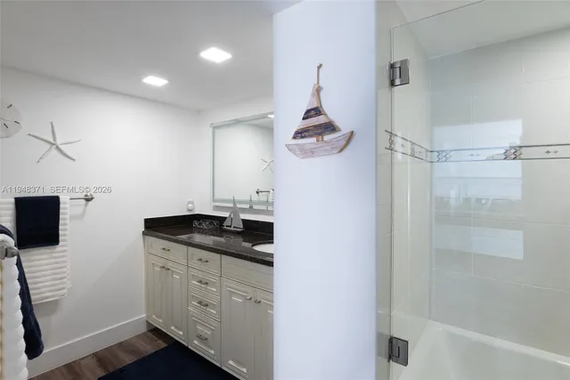 a kitchen with a sink and a refrigerator