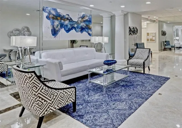 a living room with furniture and a rug