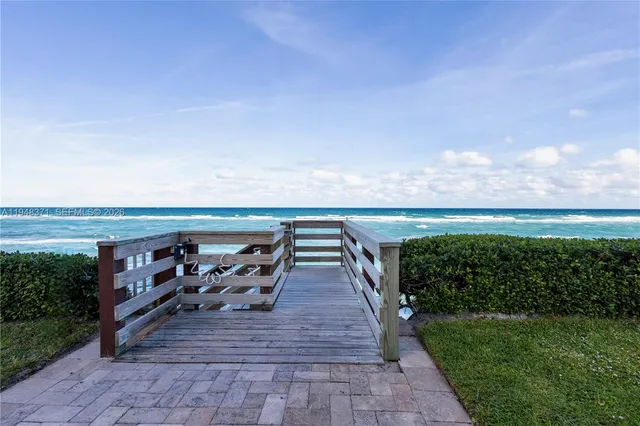 a terrace with outdoor seating and city view