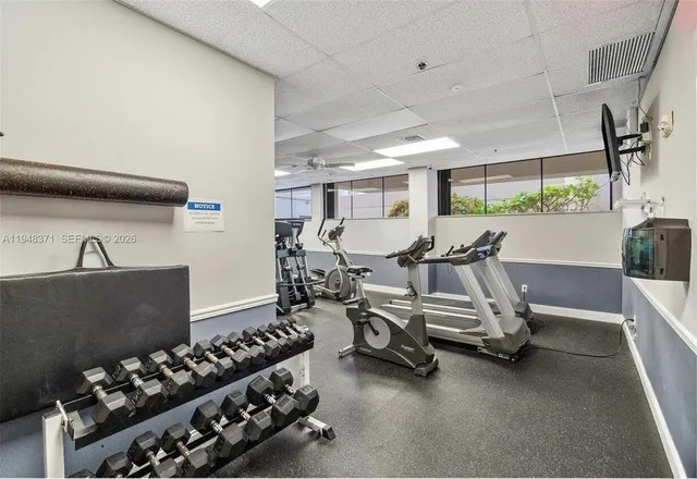 a view of a swimming pool with a chair and tables