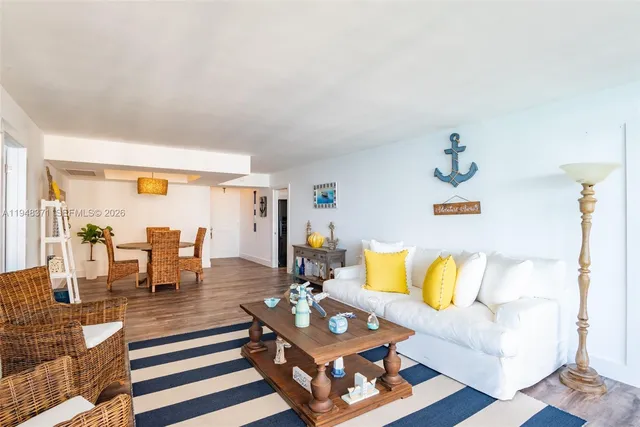 a living room with furniture and next to a window