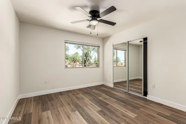 a bathroom with double vanity sinks and a mirror