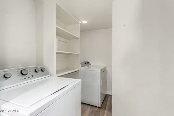 a bathroom with a toilet a sink a bath tub and shower