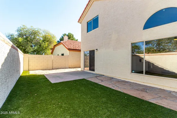 a view of a backyard of the house