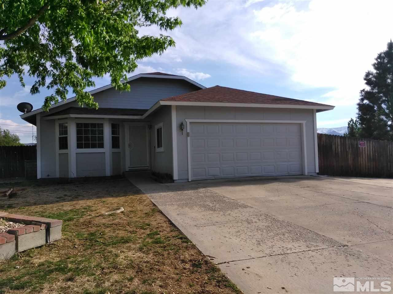 17570 Parrot Drive Reno, NV 89508 - Photo 1 of 1 a view of house with outdoor space area and wooden fence
