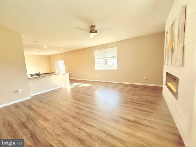 a view of a kitchen and wooden floor