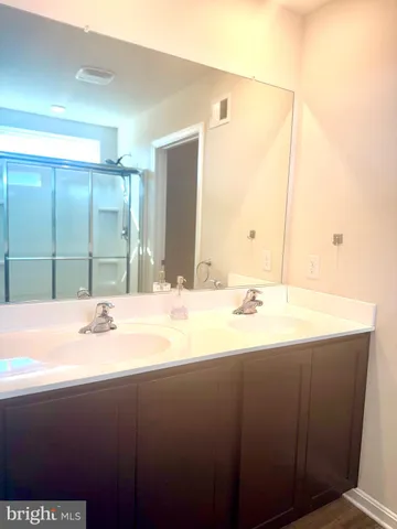 an empty room with closet and wooden door