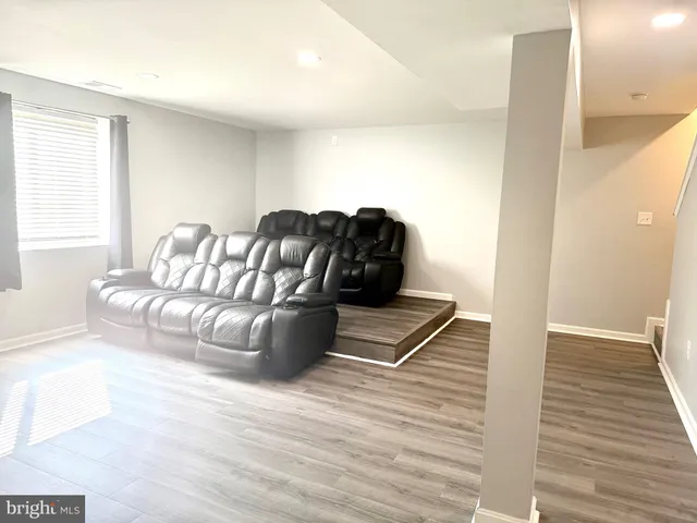 a bathroom with a sink a mirror and a window