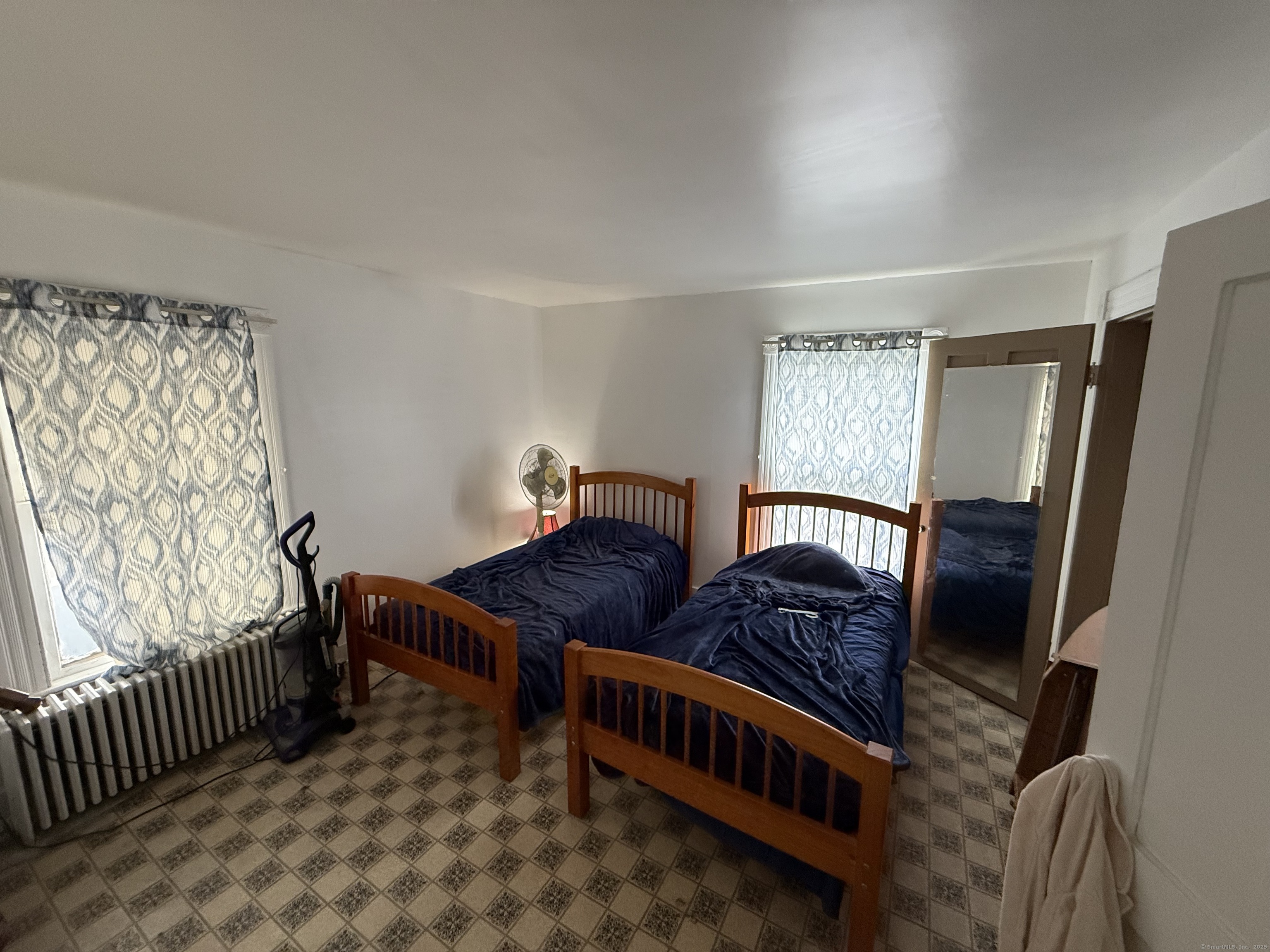 60 Capitol Avenue Meriden, CT 06451 - Photo 8 of 10 a bedroom with furniture and a window