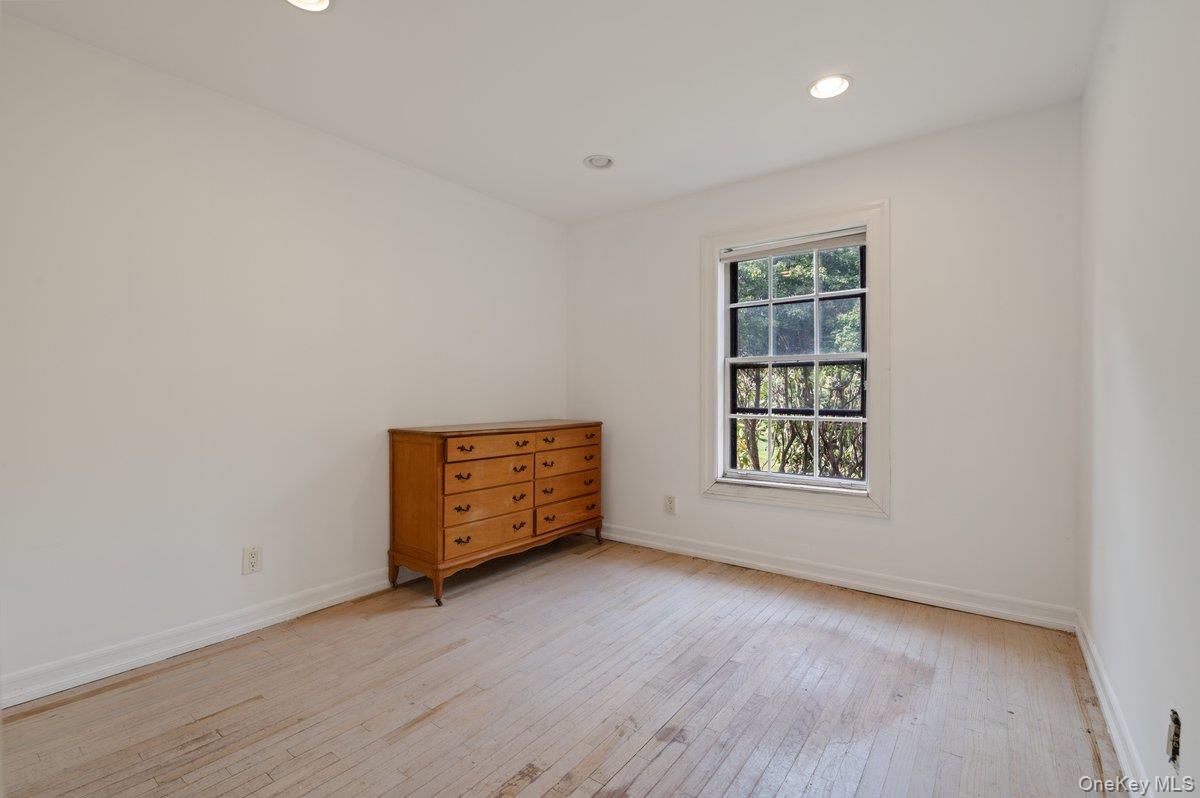 40 Nidzyn Avenue Remsenburg, NY 11960 - Photo 21 of 28 Spare room featuring light wood finished floors and recessed lighting