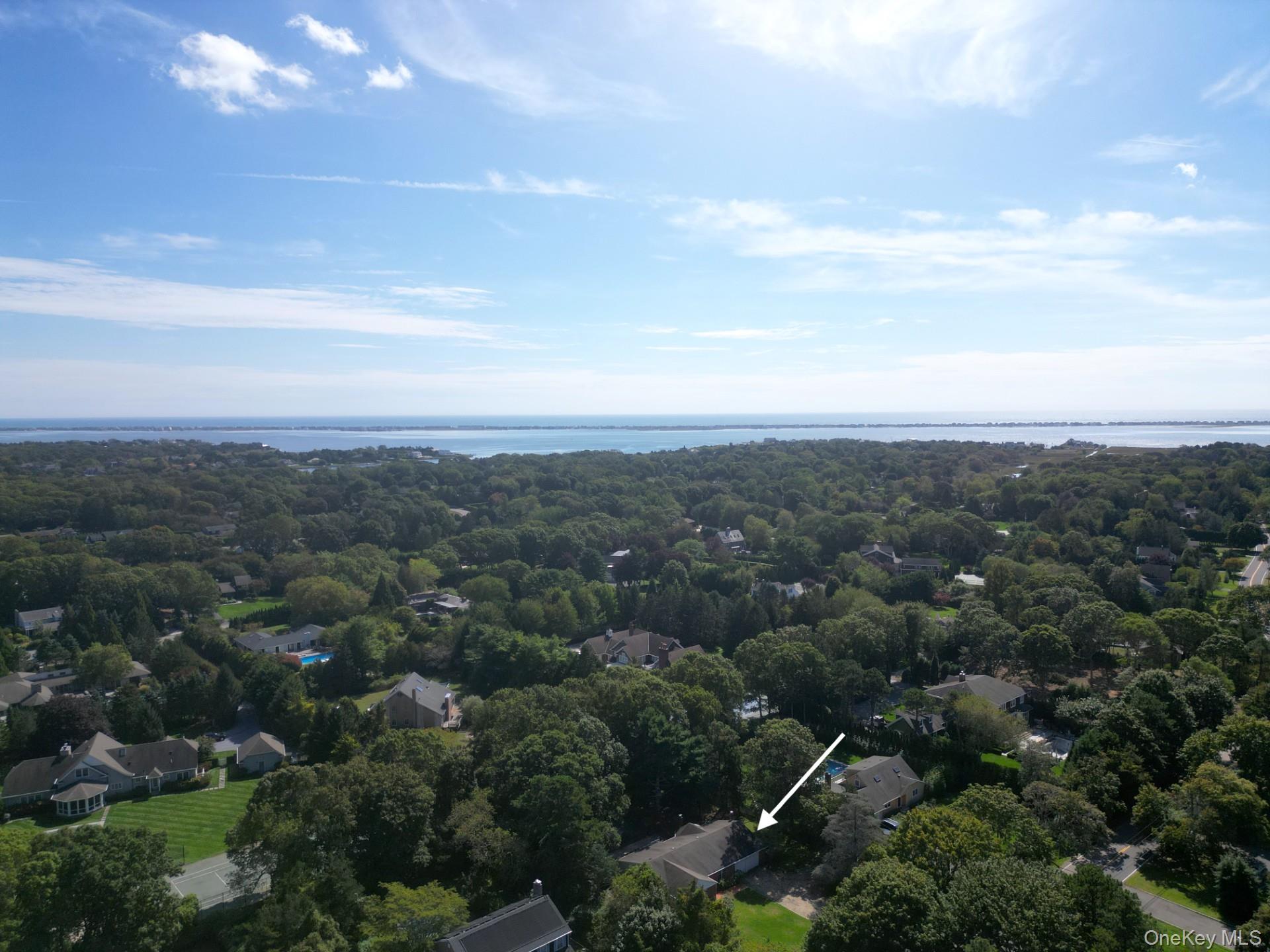40 Nidzyn Avenue Remsenburg, NY 11960 - Photo 27 of 28 Aerial view of residential area featuring a nearby body of water and property boundaries highlighted