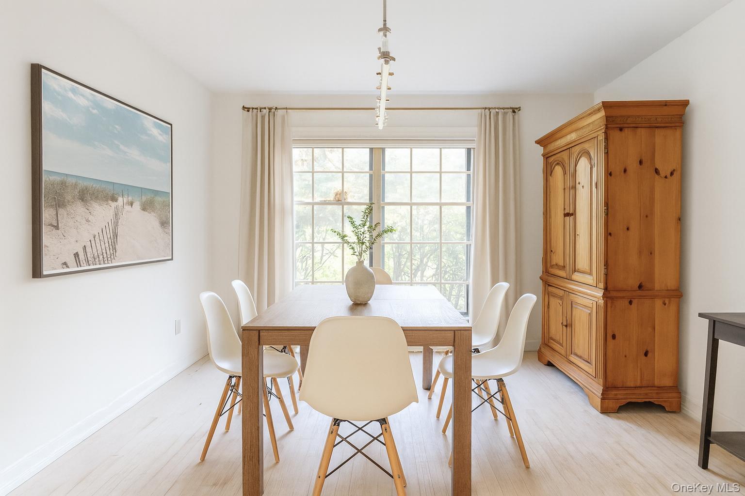 40 Nidzyn Avenue Remsenburg, NY 11960 - Photo 8 of 28 Dining room featuring light wood-style floors and baseboards