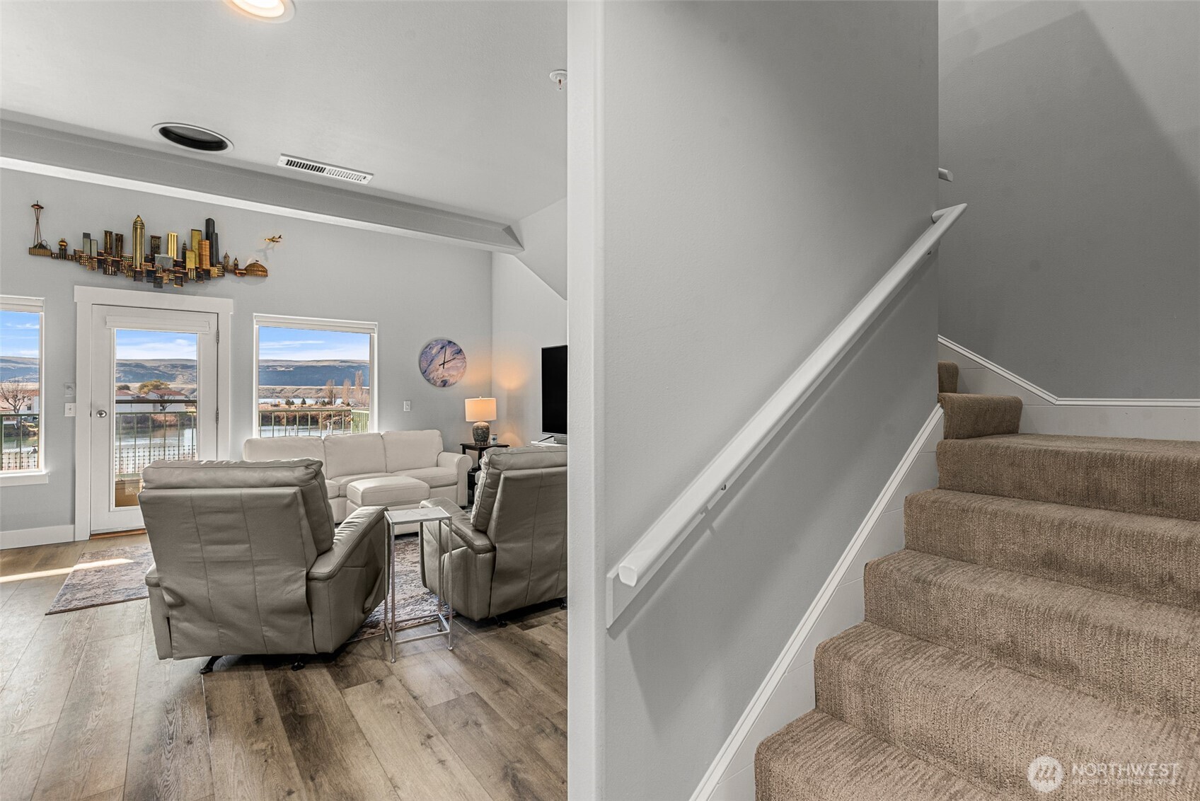 8997 Crescent Bar Road Northwest, Unit 219 Quincy, WA 98848 - Photo 21 of 40 a living room with furniture and a wooden floor