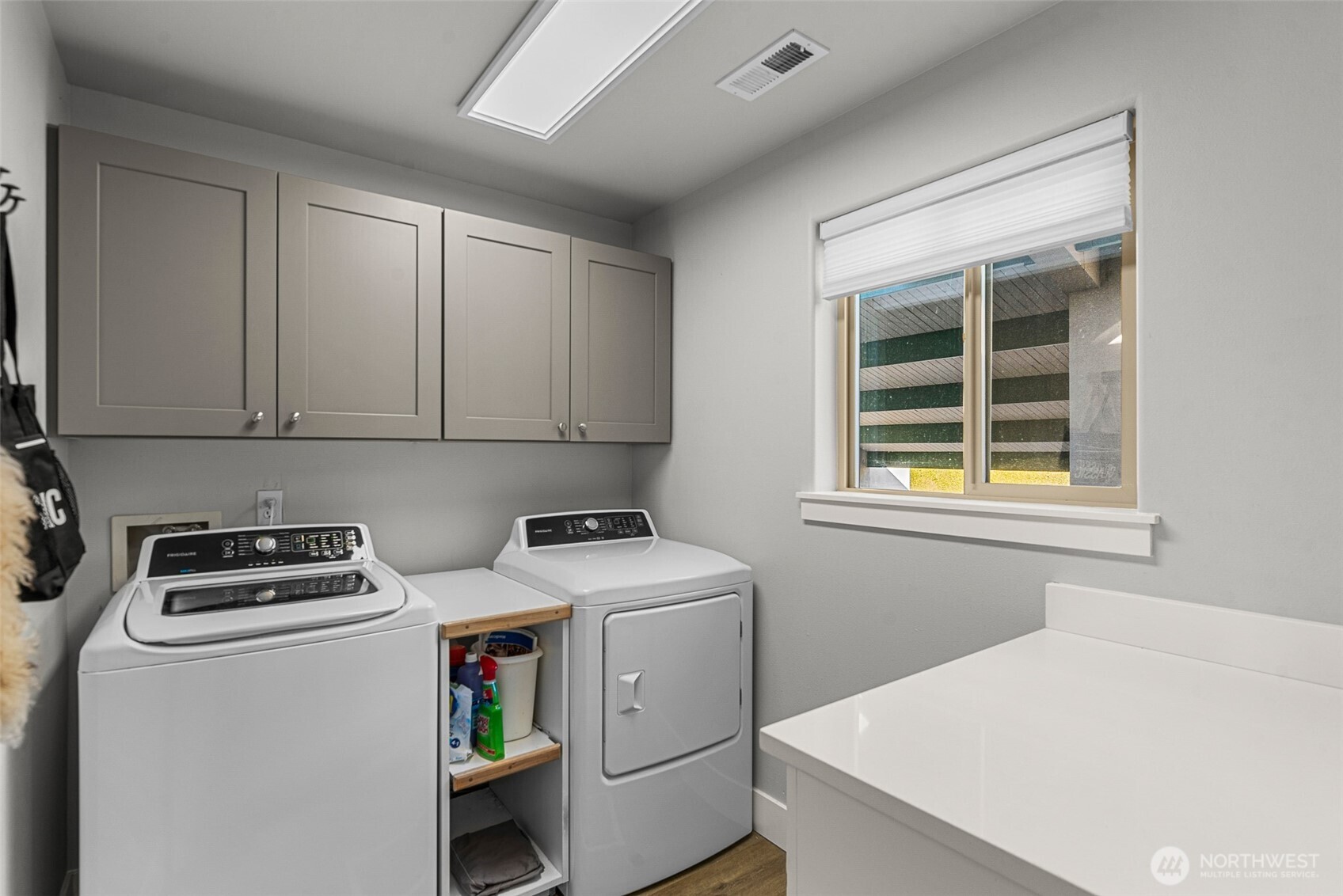 8997 Crescent Bar Road Northwest, Unit 219 Quincy, WA 98848 - Photo 23 of 40 a utility room with dryer washer and a window