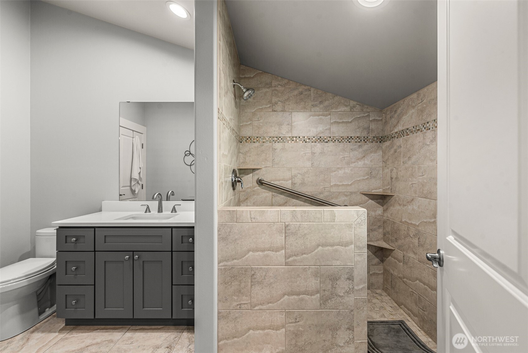 8997 Crescent Bar Road Northwest, Unit 219 Quincy, WA 98848 - Photo 32 of 40 a bathroom with a sink a toilet and shower