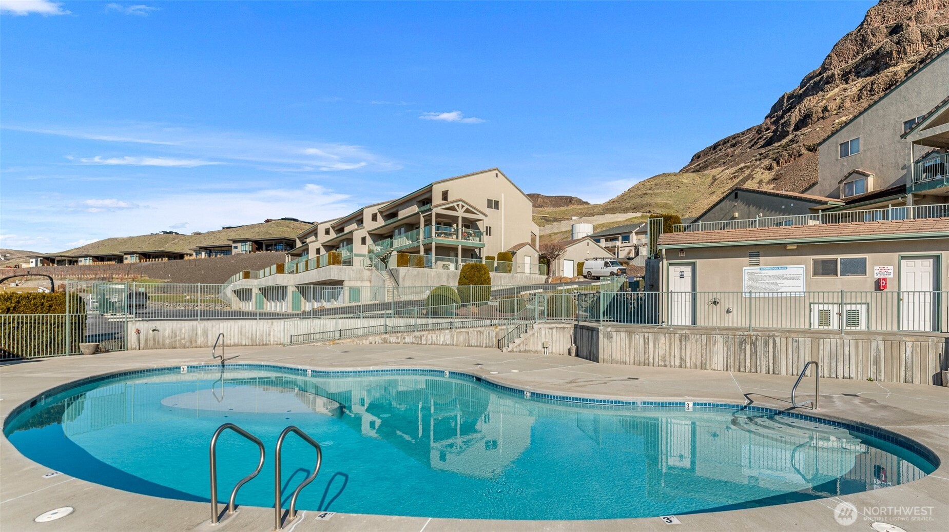 8997 Crescent Bar Road Northwest, Unit 219 Quincy, WA 98848 - Photo 38 of 40 a view of a house with pool and chairs