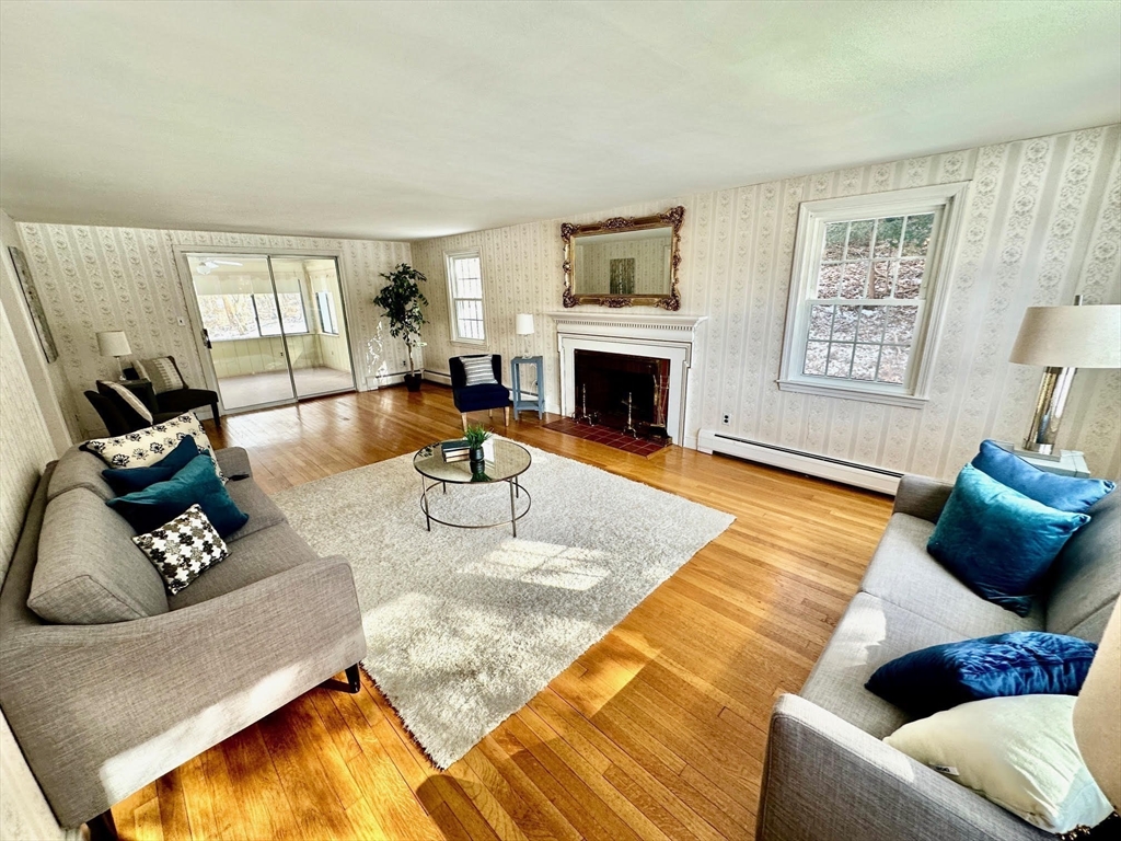 105 Marrett Road Lexington, MA 02421 - Photo 2 of 12 a living room with furniture fireplace and a window