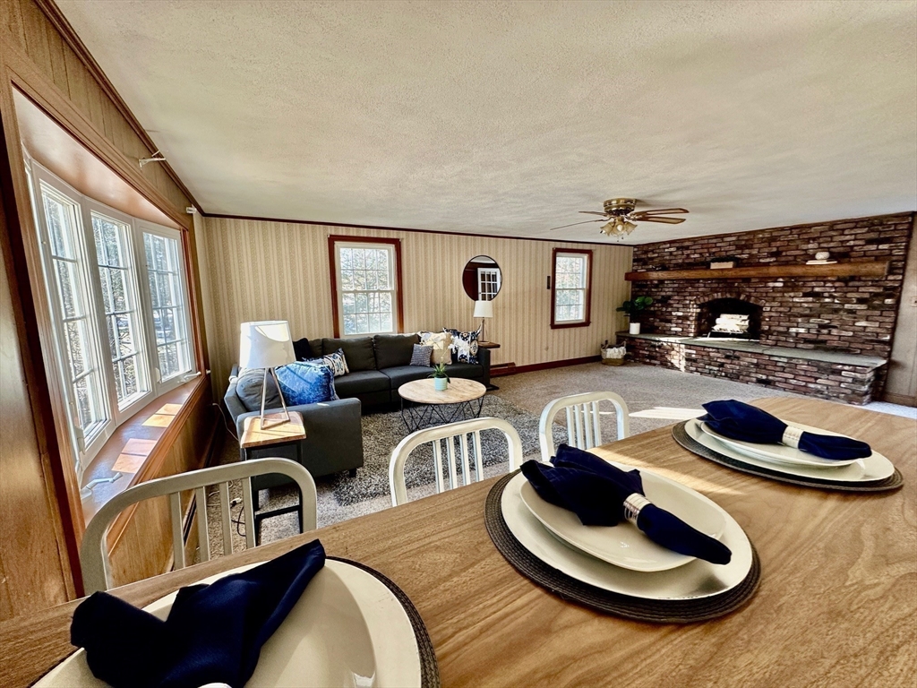 105 Marrett Road Lexington, MA 02421 - Photo 5 of 12 a living room with furniture and a wooden floor