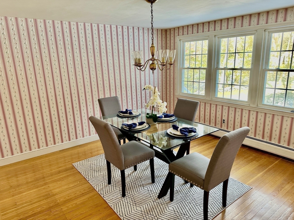 105 Marrett Road Lexington, MA 02421 - Photo 8 of 12 a view of a dining room with furniture window and wooden floor