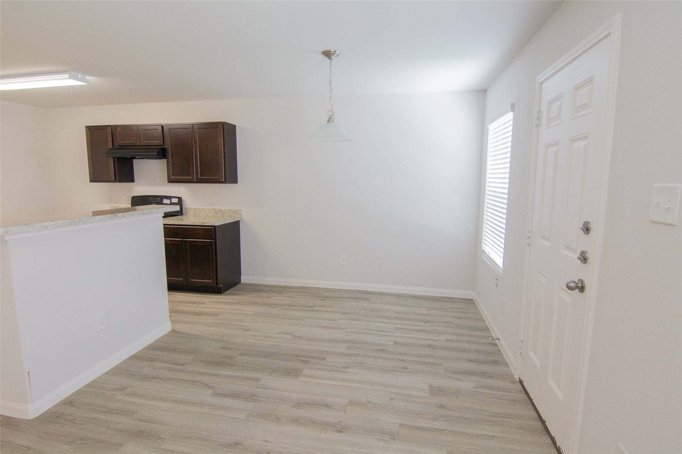 18611 Bell Ravine Drive Katy, TX 77449 - Photo 5 of 12 a view of a kitchen with a sink and a microwave